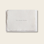 White textured card with text on a light beige background