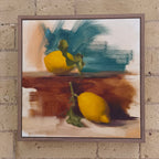 Framed painting of lemons on a textured wall