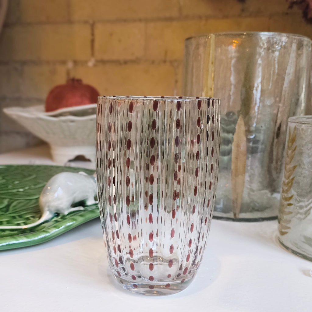 Decorative glass vase on a kitchen counter with a blurred background
