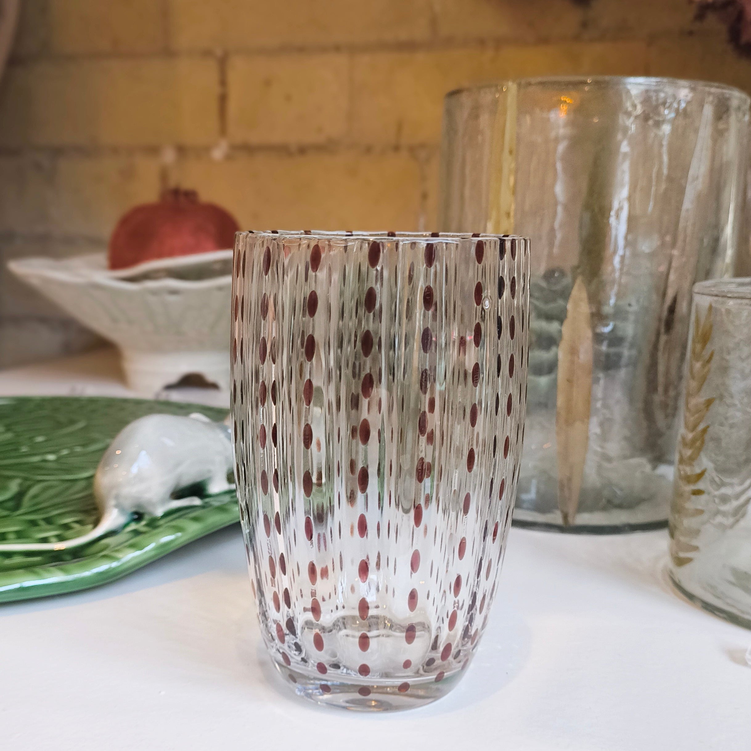 Decorative glass vase on a kitchen counter with a blurred background