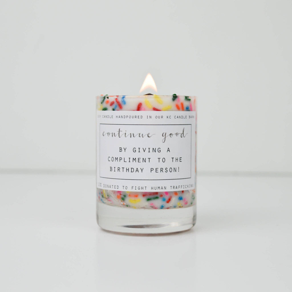 Candle with a colorful label on a white background
