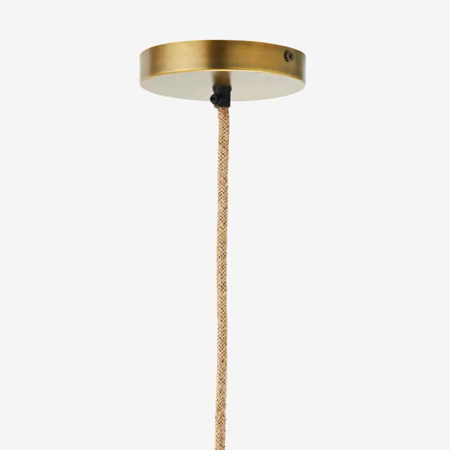 Brass ceiling light fixture with a rope-like pendant on a white background