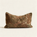Sylvie reversible tapestry lumbar cushion with muted red and green floral pattern on a cream base and green velvet edge