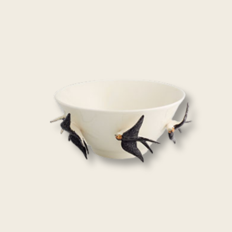 cream ceramic bowl with back swallow birds around the outside