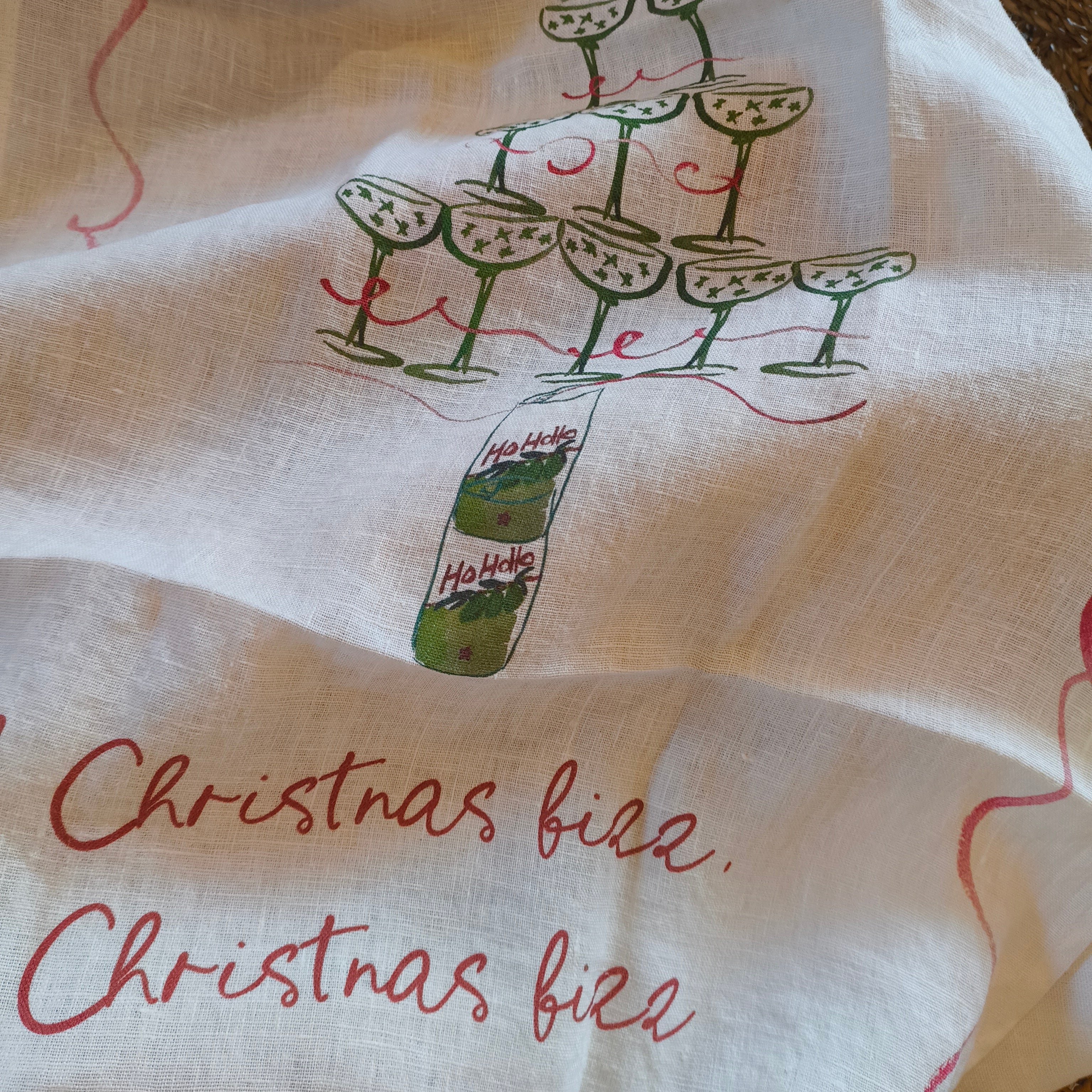 tea towel with Christmas tree design and 'Christmas tree' text on a white background.