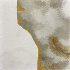 Detail of the Terra rug pile in cream and stone with gold veins