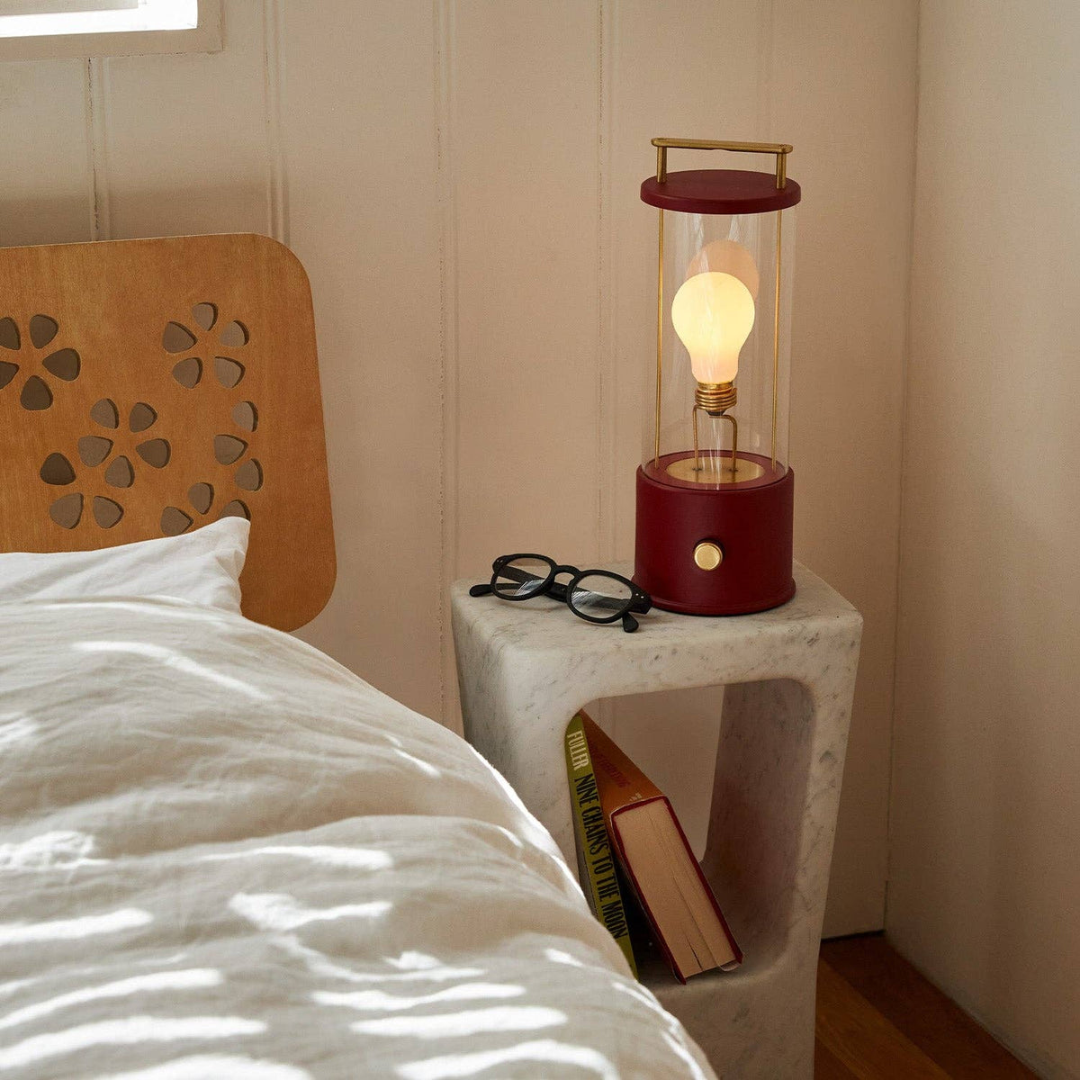 The Muse portable lamp in Pomona Red in a home setting