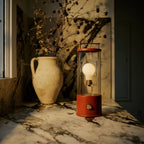 The Muse portable lamp in Pomona Red outdoors