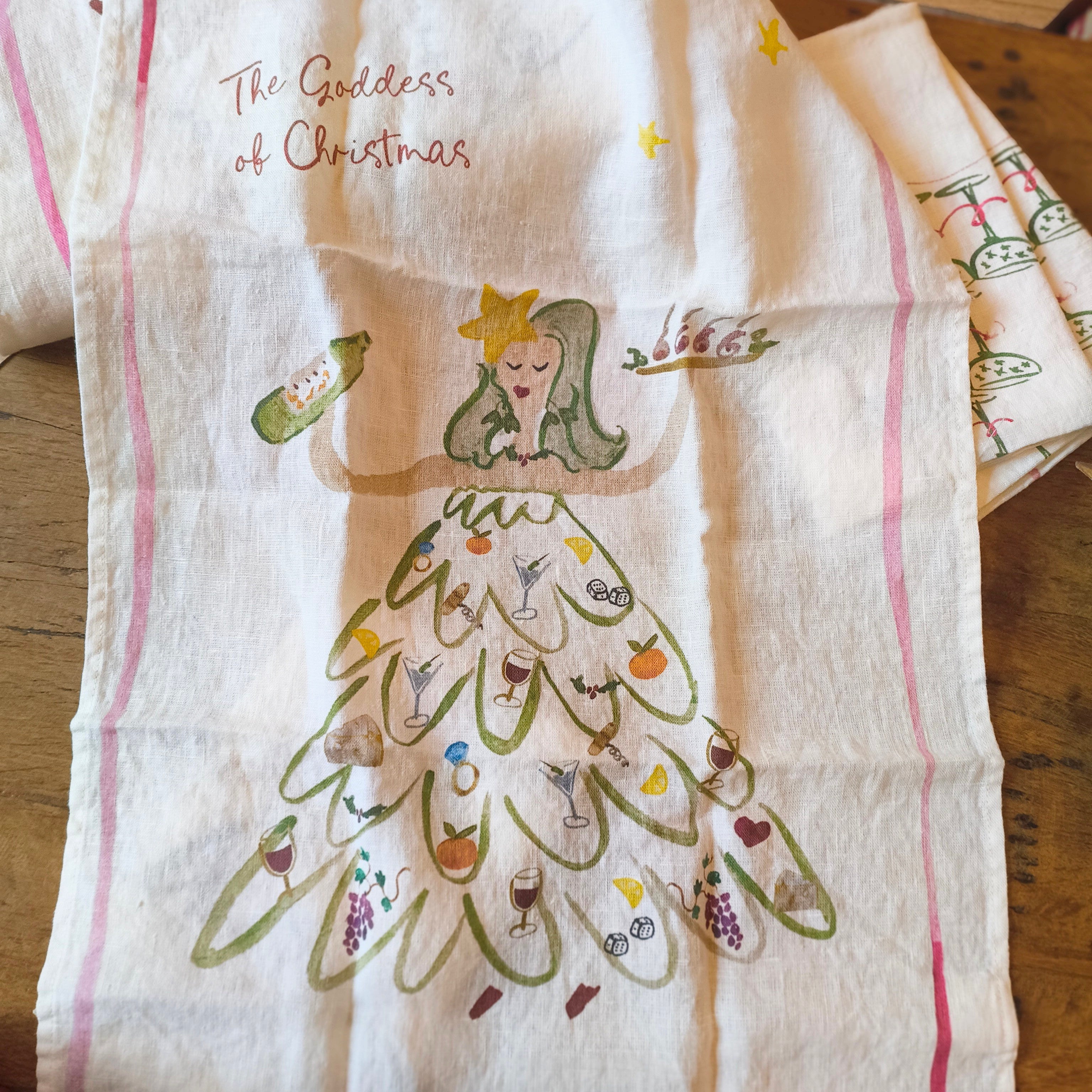 illustration on linen tea towel of goddess of christmas