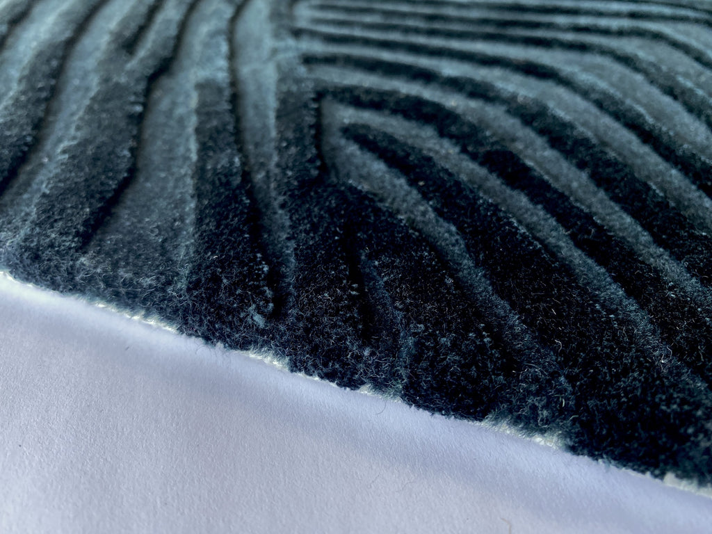 Close up of the Trace mineral rug showing the cut pile and fine contour lines