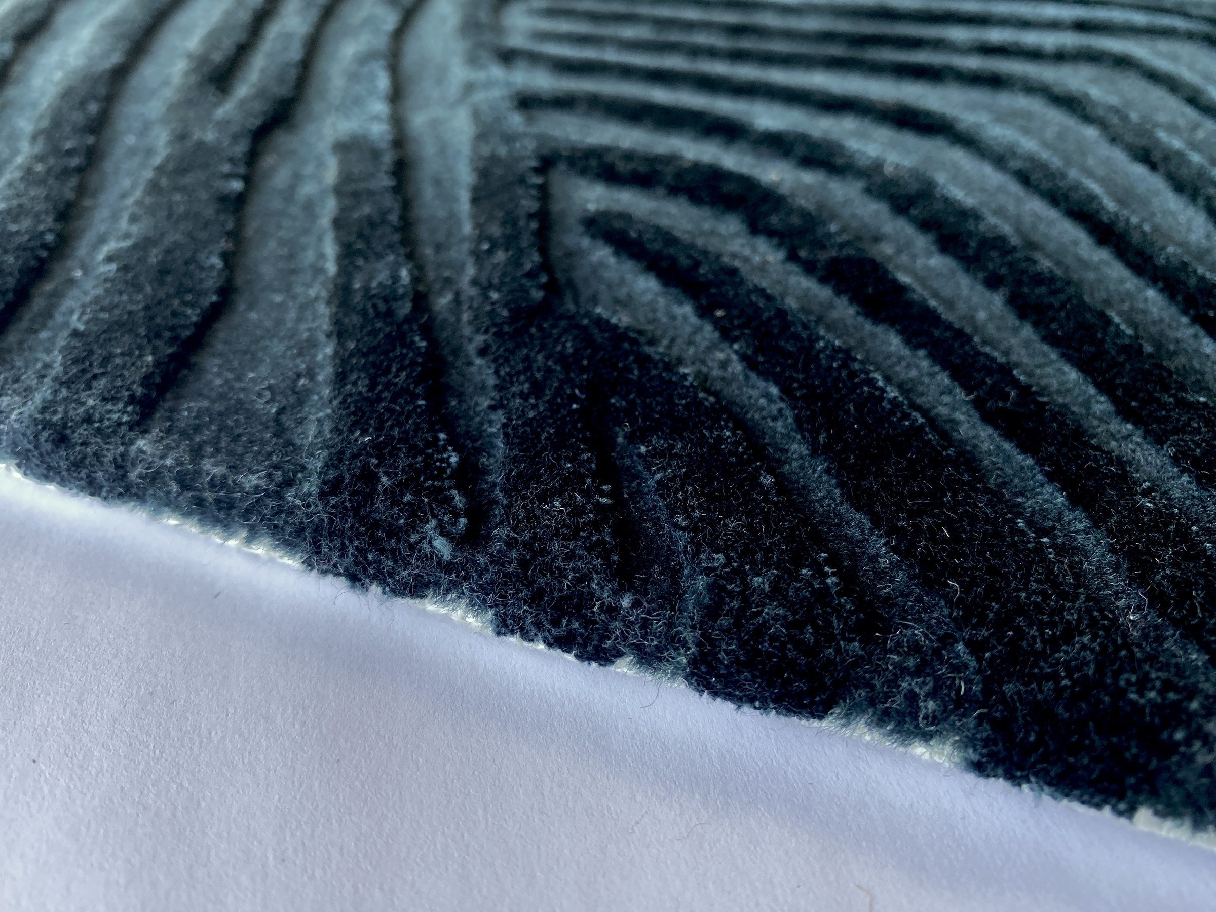 Close up of the Trace mineral rug showing the cut pile and fine contour lines