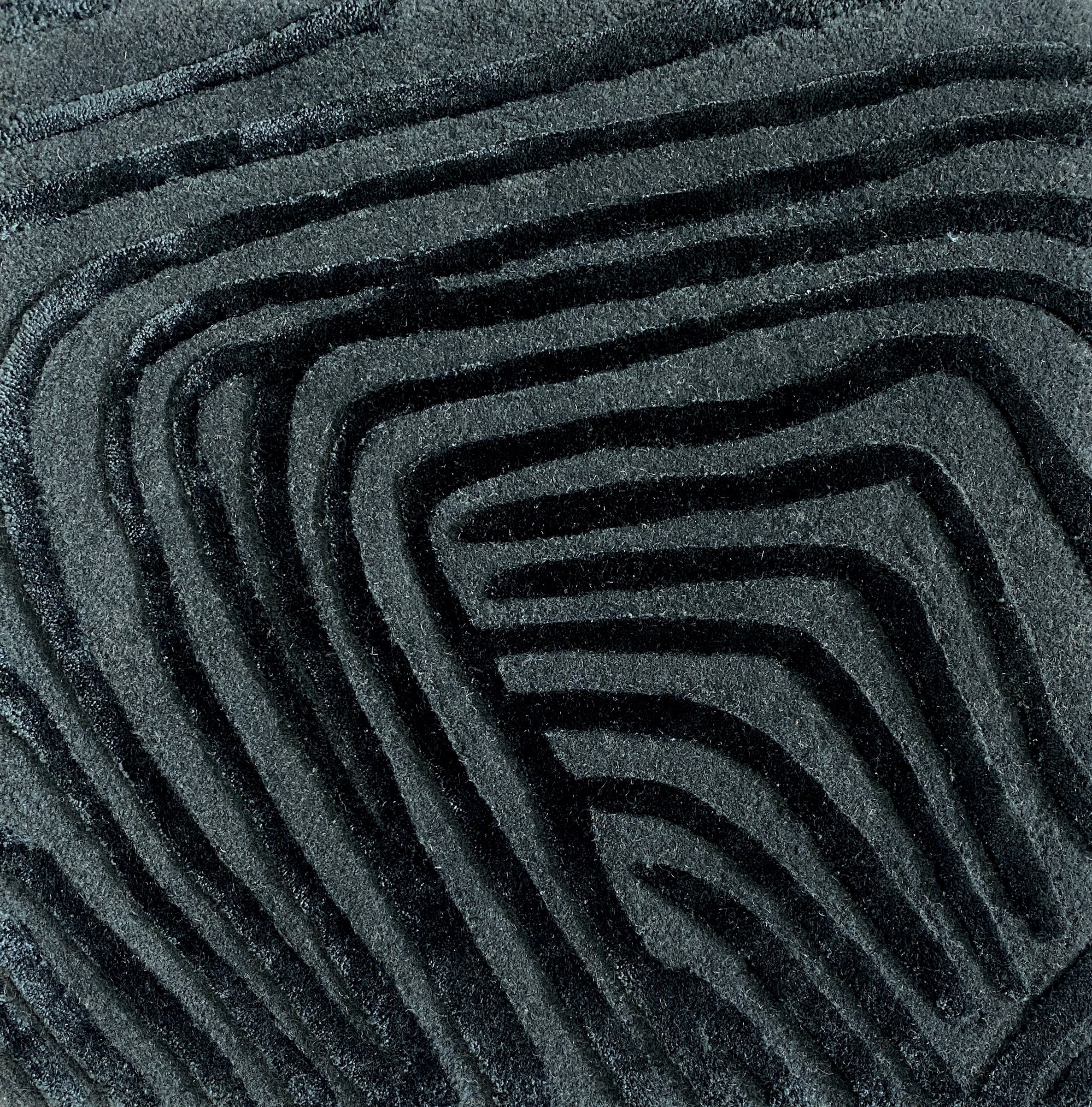 Detail of the Trace mineral rug pile in deep teal