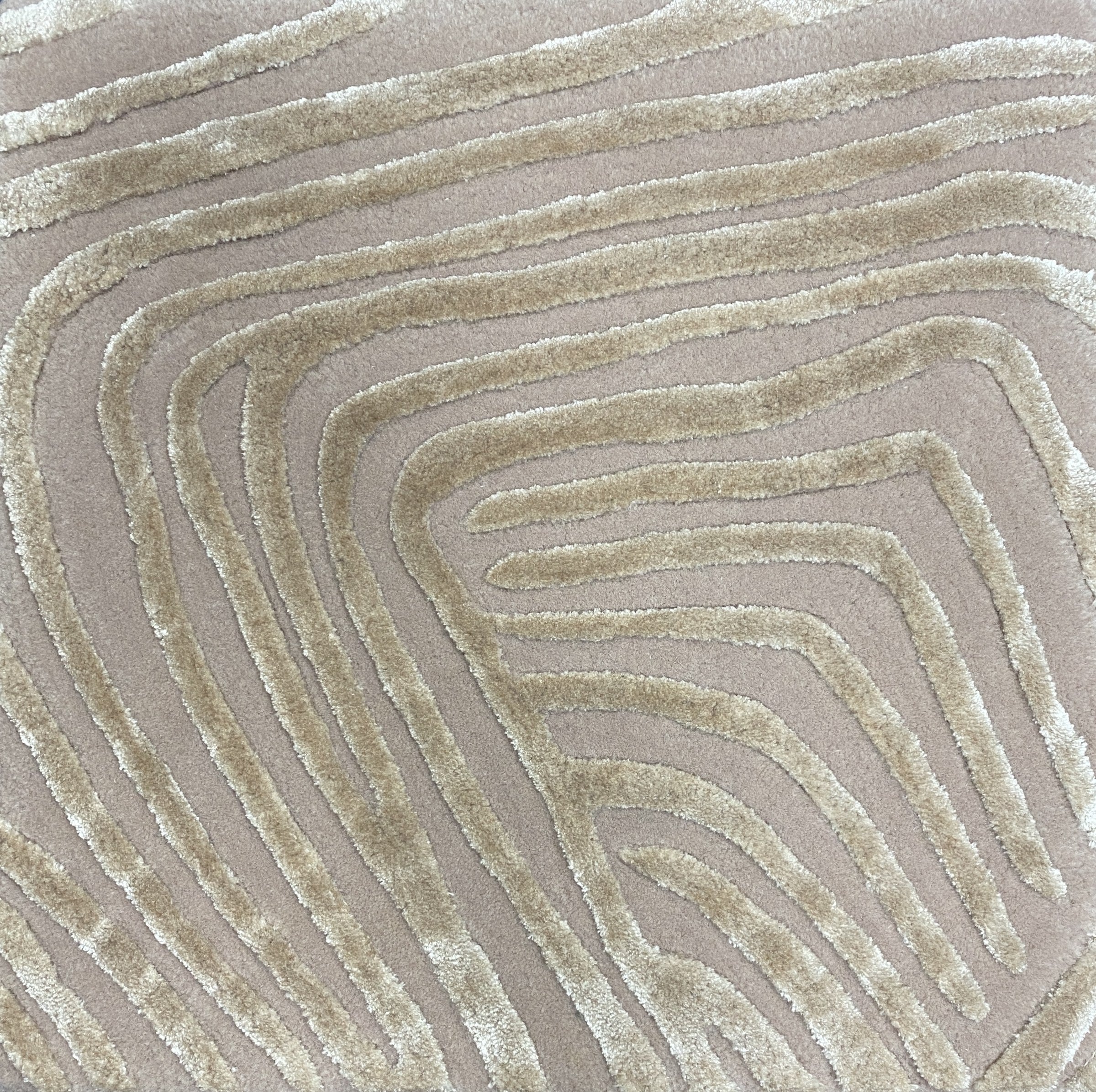 Detail of the Trace oyster rug pile in oatmeal greige