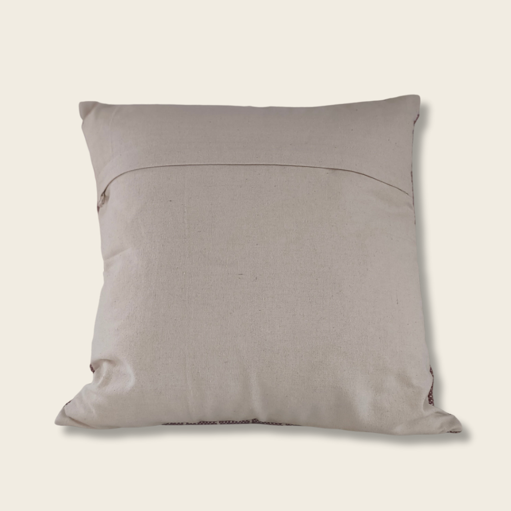 Back of plum stripe cushion which is a plain beige linen with an envelope entry