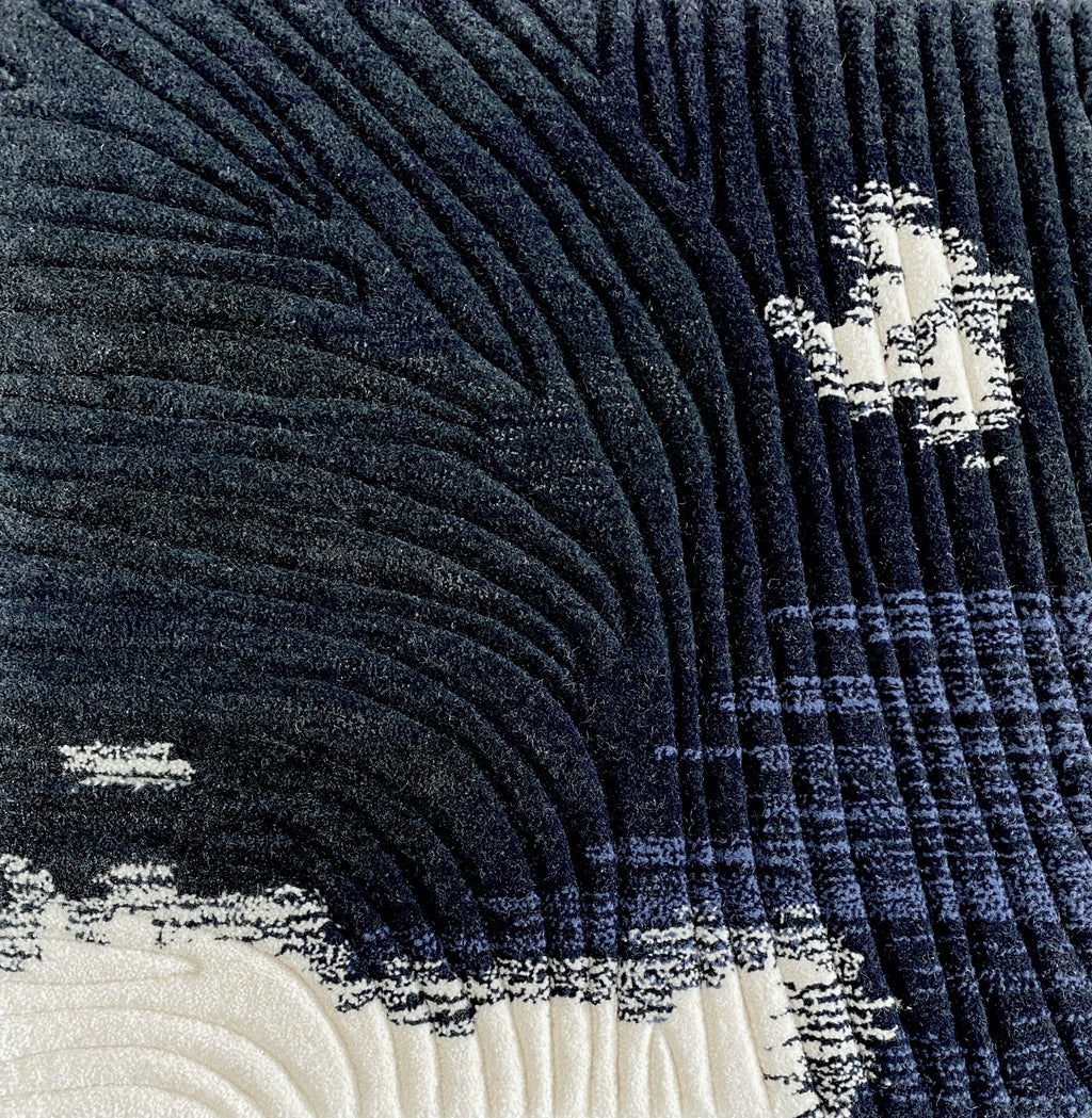 Detail of the Trove midnight rug pile in deep navy with ivory