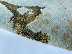 Close up of the Tundra rug showing the cut and loop pile and terrazzo flecks