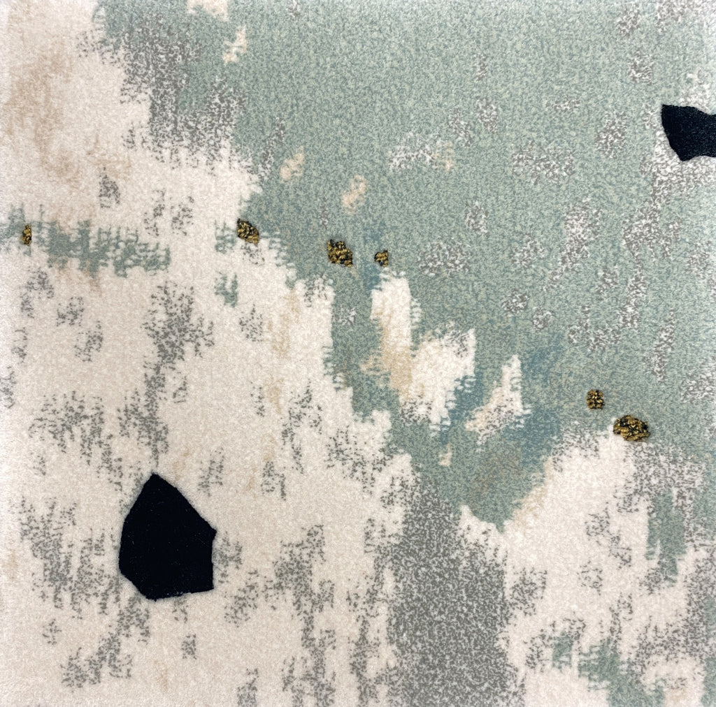 Detail of the Tundra rug pile in sage green, stone and gold