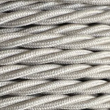 Close-up of braided fabric cable on a light gray background