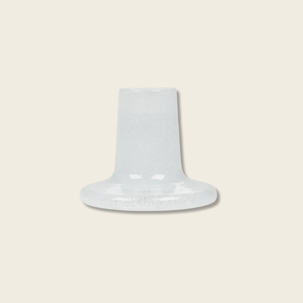  white glass candle stand against a white background