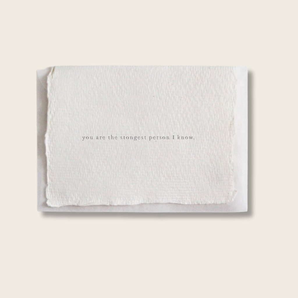 White card with text on a light beige background
